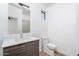 Modern bathroom featuring wood-style flooring, white vanity, and a contemporary light fixture at 4220 N 32Nd St # 36, Phoenix, AZ 85018