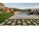 Landscaped backyard oasis with a beautiful pool and patio at 4308 N Sage Creek Cir, Mesa, AZ 85207