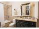 Bathroom with a bathtub, toilet, and dark wood vanity at 4308 N Sage Creek Cir, Mesa, AZ 85207