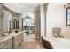 Elegant bathroom with soaking tub and double vanity at 4308 N Sage Creek Cir, Mesa, AZ 85207