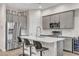 Stylish kitchen with gray cabinets, stainless steel appliances, and a white countertop at 4316 E Berkeley Rd, Phoenix, AZ 85008