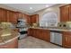 Modern kitchen featuring granite countertops, stainless steel appliances, and ample counter space at 4627 E Jude Ln, Gilbert, AZ 85298