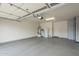 Spacious garage interior with storage cabinets, water heater, and door at 5252 W Posse Dr, Eloy, AZ 85131