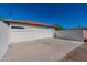 Clean detached garage with a modern white door at 705 W Vernon Ave, Phoenix, AZ 85007