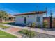 White stucco guest house with a walkway and landscaping at 705 W Vernon Ave, Phoenix, AZ 85007