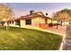 Single-story home with tan exterior and grassy backyard at 8260 E Keats Ave # 508, Mesa, AZ 85209