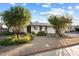 Charming single-story home with desert landscaping and a paved driveway at 8307 E Weldon Ave, Scottsdale, AZ 85251