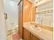 Bathroom with vanity, wood cabinets, and shower with sliding glass door at 8865 E Baseline Rd # 1129, Mesa, AZ 85209