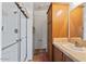Bathroom with shower, toilet and vanity with wood cabinets at 8865 E Baseline Rd # 1129, Mesa, AZ 85209