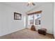 Bright bedroom with carpeted floor, window, and ceiling fan at 8865 E Baseline Rd # 1129, Mesa, AZ 85209