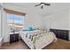 Bedroom with large window, ceiling fan, and dresser at 8865 E Baseline Rd # 1129, Mesa, AZ 85209