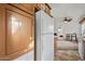 Kitchen features wood cabinets and a white refrigerator at 8865 E Baseline Rd # 1129, Mesa, AZ 85209