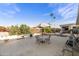 Large backyard patio with seating and desert landscaping at 918 S Ember Cir, Mesa, AZ 85208