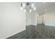 Dining room with modern chandelier and tile flooring at 993 S Lawson Dr, Apache Junction, AZ 85120