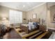 Spacious main bedroom with wooden furniture, plush carpet, and large windows with shutters at 9936 E Winter Sun Dr, Scottsdale, AZ 85262