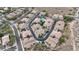 Aerial view of townhome community with curved roads, desert landscaping, and ample parking spaces at 10055 N 142Nd St # 1020, Scottsdale, AZ 85259