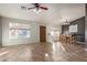 Dining area adjacent to the living room with tile floors and windows at 1006 W 15Th Ln, Apache Junction, AZ 85120