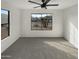 Carpeted bedroom with large window providing natural light at 11214 W Rio Vista Ln, Avondale, AZ 85323