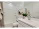 Clean and modern bathroom with white fixtures, a bathtub, and a single vanity at 15771 W Superior Ave, Goodyear, AZ 85338