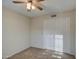 Bedroom with ceiling fan and double door closet at 2042 Leisure World --, Mesa, AZ 85206