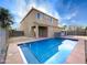Backyard oasis featuring a refreshing pool and a modern home exterior at 3636 E Stampede Dr, Gilbert, AZ 85297