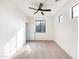 Bedroom with carpet flooring, ceiling fan, and large windows at 3636 E Stampede Dr, Gilbert, AZ 85297