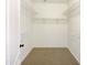 Spacious walk-in closet with built-in shelving at 3636 E Stampede Dr, Gilbert, AZ 85297