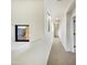 Carpeted hallway with ample natural light from large windows at 3636 E Stampede Dr, Gilbert, AZ 85297