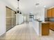 Bright open kitchen and dining area with tile flooring and access to the backyard at 3636 E Stampede Dr, Gilbert, AZ 85297