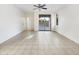 Spacious living area with tile flooring and sliding glass doors leading to a backyard pool at 3636 E Stampede Dr, Gilbert, AZ 85297