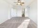 Large main bedroom with carpet and a ceiling fan at 3636 E Stampede Dr, Gilbert, AZ 85297
