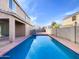 Inviting backyard pool with surrounding patio and block wall fencing at 3636 E Stampede Dr, Gilbert, AZ 85297