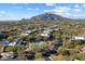 Community pool and surrounding buildings, with mountain backdrop at 36601 N Mule Train Rd # B14, Carefree, AZ 85377