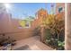 Private courtyard with blooming bougainvillea and stairs at 36601 N Mule Train Rd # B14, Carefree, AZ 85377