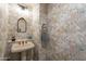 Powder room with unique patterned wallpaper and vintage-style fixtures at 36601 N Mule Train Rd # B14, Carefree, AZ 85377