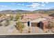 Single-story home with a tile roof and a two-car garage, mountain views at 38500 N School House Rd # 45, Cave Creek, AZ 85331