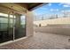 Private backyard patio with brick pavers and sliding glass doors at 38500 N School House Rd # 45, Cave Creek, AZ 85331