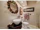 Stylish bathroom featuring a modern vessel sink and decorative mirror at 4525 N 66Th St # 14, Scottsdale, AZ 85251