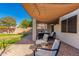 Backyard patio with seating area under shade sail at 4660 E Torrey Pines Lane Ln, Chandler, AZ 85249