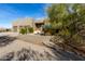 Front exterior view of the home with driveway, landscaping, and desert plants at 512 E Tanya Trl, Phoenix, AZ 85086