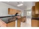 Open kitchen layout with an island, ample counter space, and wooden cabinetry at 512 E Tanya Trl, Phoenix, AZ 85086