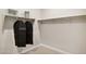 Spacious walk-in closet with hanging rods, shelving, and garment bags at 5841 E Ringtail Way, Phoenix, AZ 85054