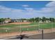 Community ball field with green grass and bleachers at 650 N Hawes Rd # 4412, Mesa, AZ 85207