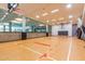 Indoor basketball court with hardwood floors and viewing area at 7151 E Rancho Vista Dr # 4001, Scottsdale, AZ 85251