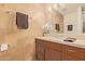 Bathroom vanity with sink, mirror, and brown cabinets at 7151 E Rancho Vista Dr # 4001, Scottsdale, AZ 85251