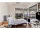 Bedroom with ample natural light, wood floors, and modern furnishings at 7151 E Rancho Vista Dr # 4001, Scottsdale, AZ 85251
