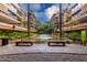 Courtyard with water feature, benches, and lush landscaping at 7151 E Rancho Vista Dr # 4001, Scottsdale, AZ 85251