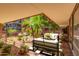 Courtyard with swing, seating area, and lush plants at 7151 E Rancho Vista Dr # 4001, Scottsdale, AZ 85251