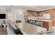 Dining area and kitchen with stainless steel appliances and wood cabinetry at 7151 E Rancho Vista Dr # 4001, Scottsdale, AZ 85251