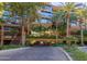 Modern building exterior with balconies, palm trees, and a driveway at 7151 E Rancho Vista Dr # 4001, Scottsdale, AZ 85251